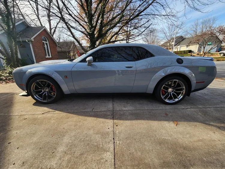 Side profile of a silver Dodge Challenger with premium automotive window tint installed by Valion Tinting, serving the Kansas City and Overland Park areas